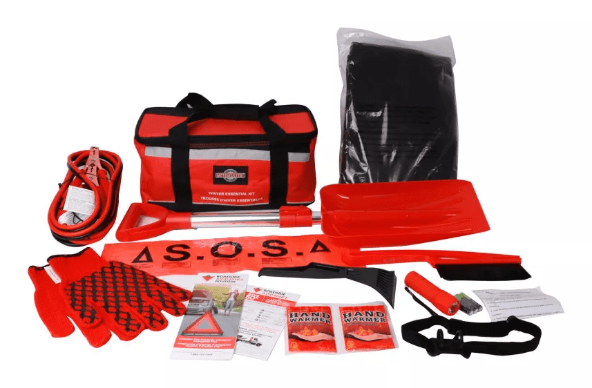 Red winter car emergency kit: bag, jumper cables, shovel, gloves, warning triangle and hand warmers