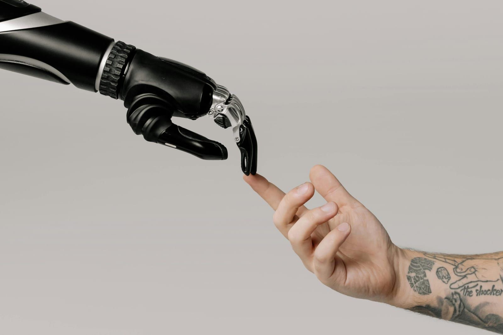 Robotic hand reaching toward a human finger