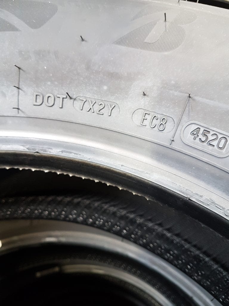 Tire sidewall DOT code ending in 4520, meaning the tire was made in week 45 of 2020