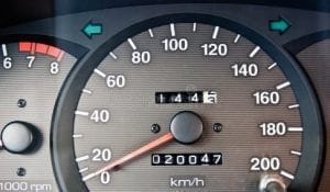 Speedometer with the odometer reading 20,047 km