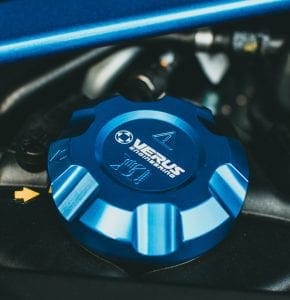 Blue Verus Engineering aftermarket oil filler cap in an engine bay