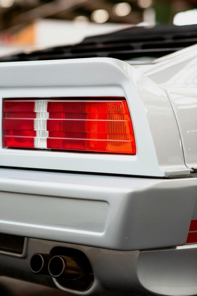Right rear view of a car with tail light and exhaust pipe