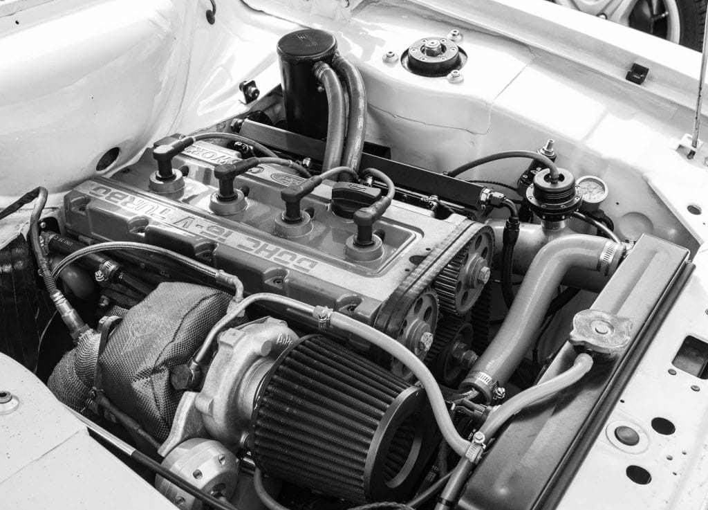 Top view of engine displaying connected spark plugs.