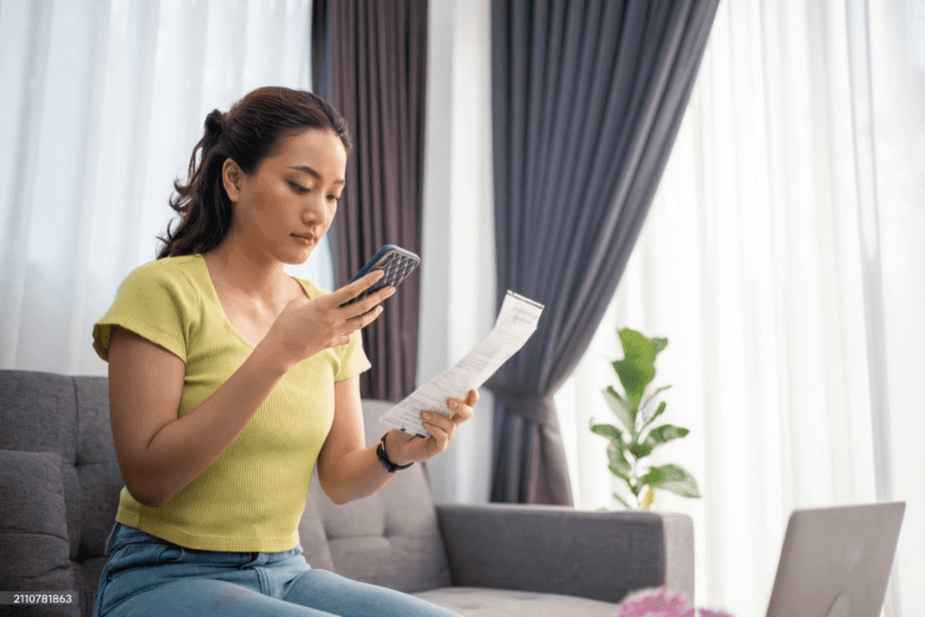 A user snapping a photo of a receipt.