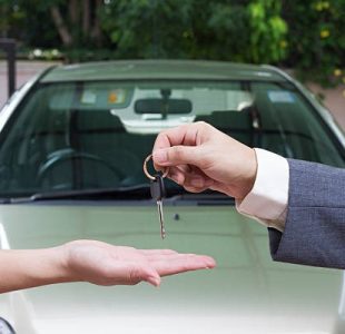 Seller handing over keys to buyer