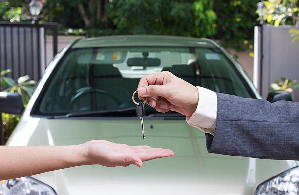 Seller handing over keys to buyer