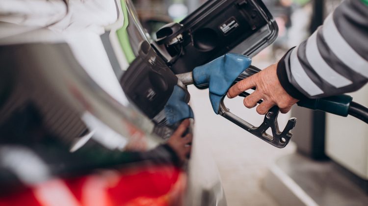 Refueling car at gas station