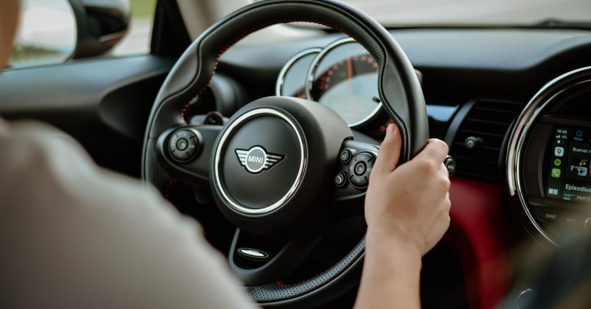 Car steering wheel prominently displaying the horn.