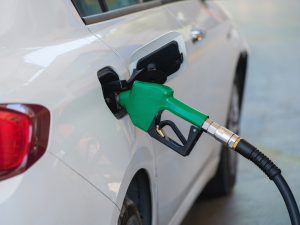 Gas pump nozzle in car gas tank