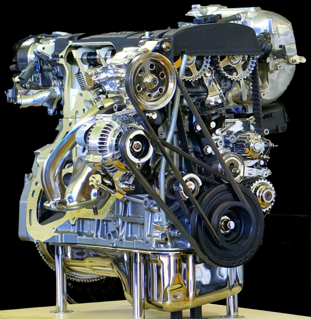 car engine on stand showing the timing belt