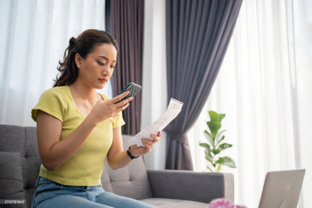 A user snapping a photo of a receipt.