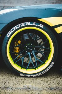 Closeup of a custom wheel on a tuner car.